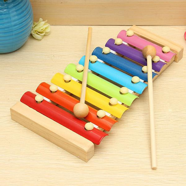 Xylophone set arranged with colorful bars and mallet for play Xylophone set arranged with colorful bars and mallet for play